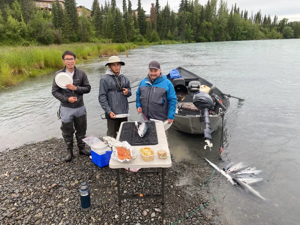 Client holding a beautiful fish caught with Cooper Landing fishing guides